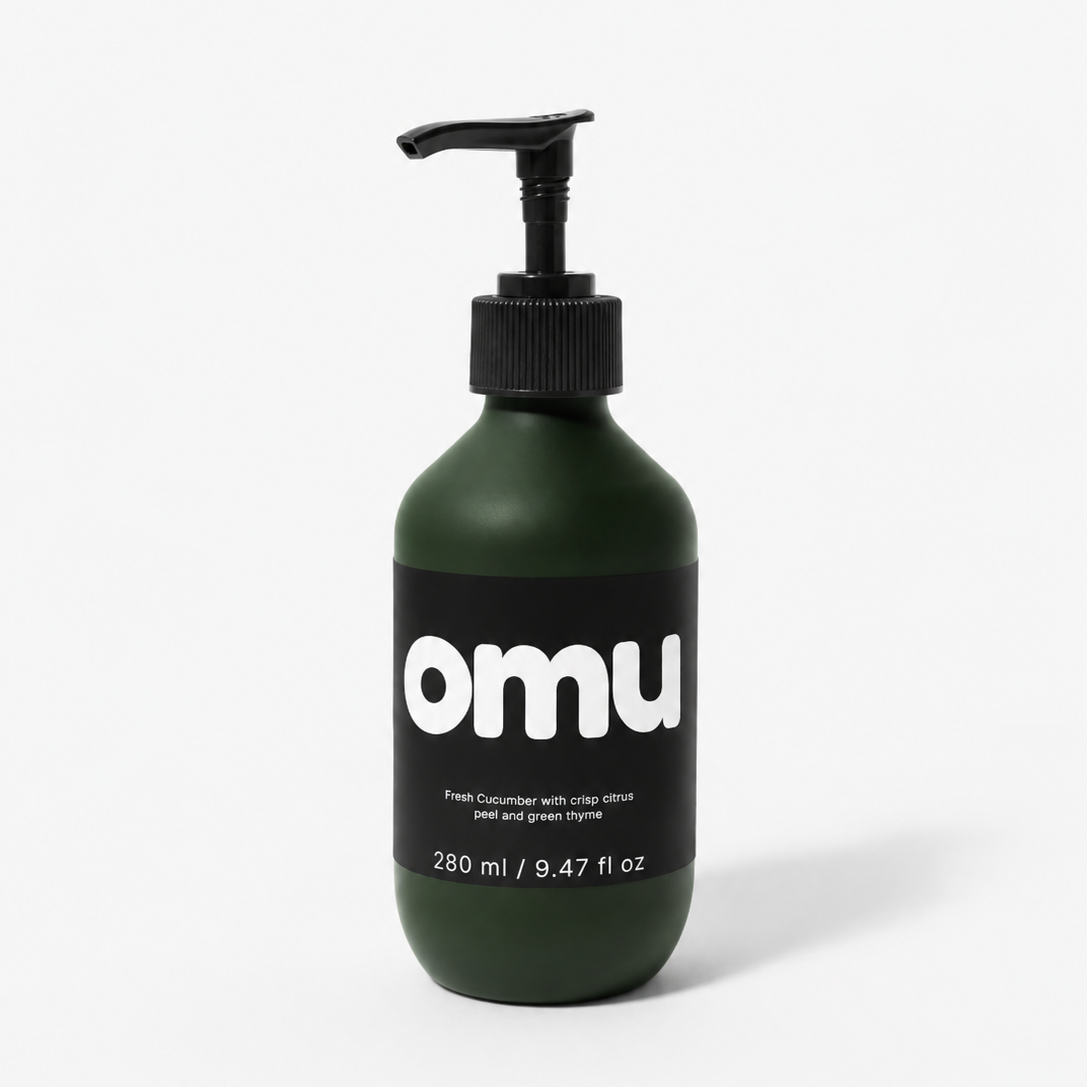 Green bottle with pump and 'omu' label on a white background